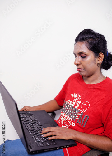 young woman working using computer laptop concentrated and confident
