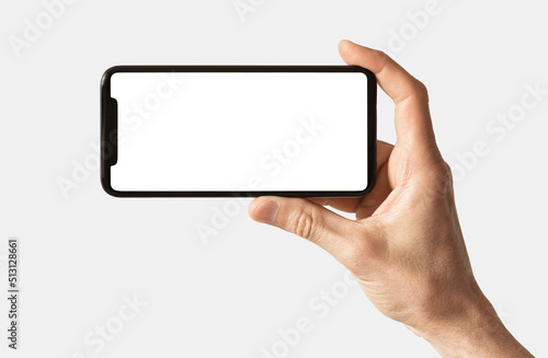 Phone mockup in hand - clipping path, black smartphone with blank mock up screen for web site design isolated on white background, app for mobile phone and advertisement