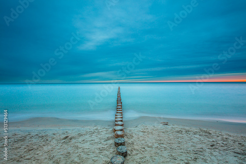 Obraz na płótnie Amazing sunrise over the sea in Chalupy. seascape with breakwater w salonie