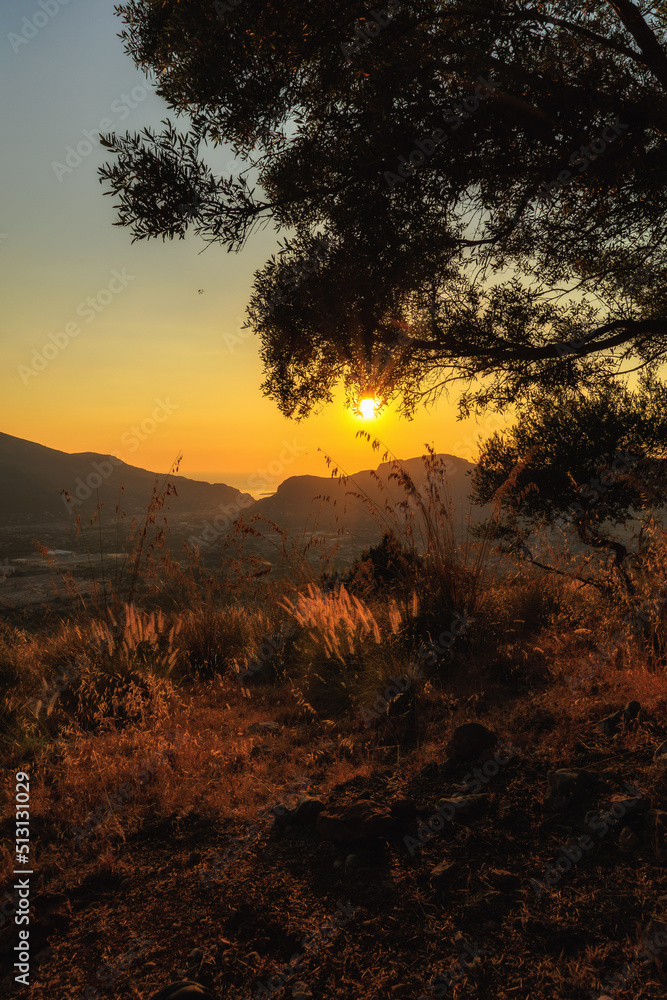 Evening in the coastal hills of Sicily on Monte Pellegrino near Palermo in Summer on a warm evening sunset Evening in the coastal hills of Sicily on Monte Pellegrino near Palermo in Summer on a warm evening sunset
