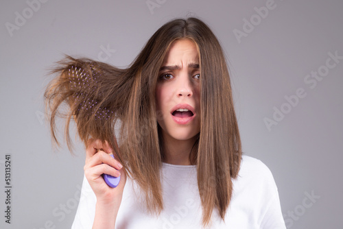 Hair for hair loss problem, woman show her hair tangled damaged hair.