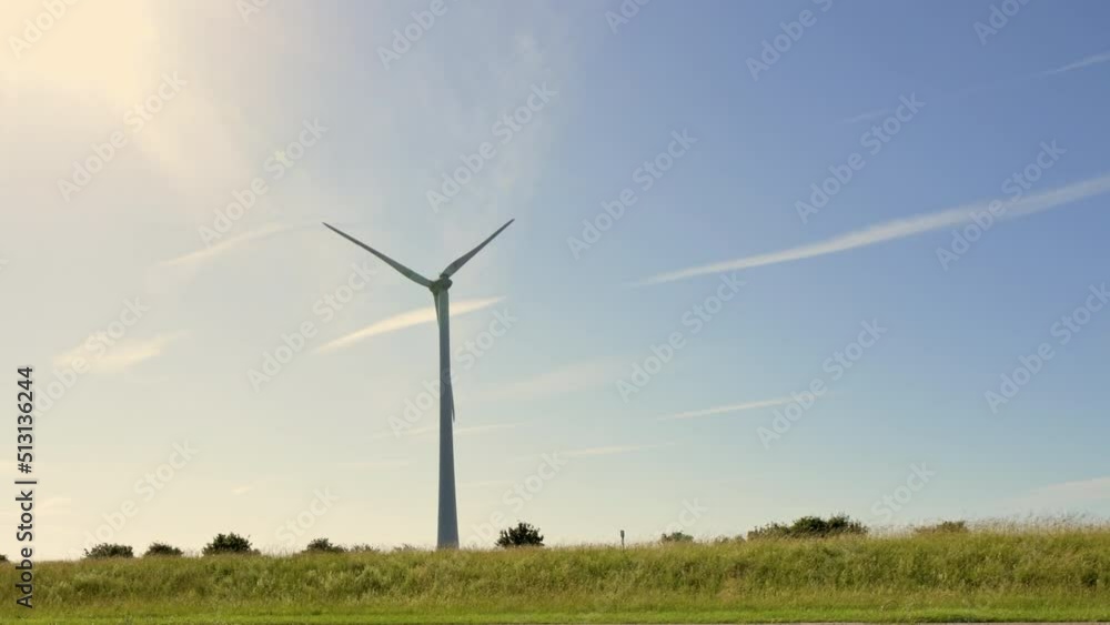 Wind power turbines generating clean renewable energy. Green energy concept. Slow motion Wind power turbines generating clean renewable energy. Green energy concept. Slow motion