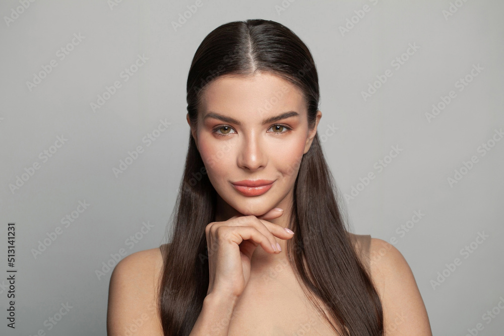 Cheerful young woman with clean healthy skin on white background. Beauty, facial treatment and cosmetic concept Cheerful young woman with clean healthy skin on white background. Beauty, facial treatment and cosmetic concept