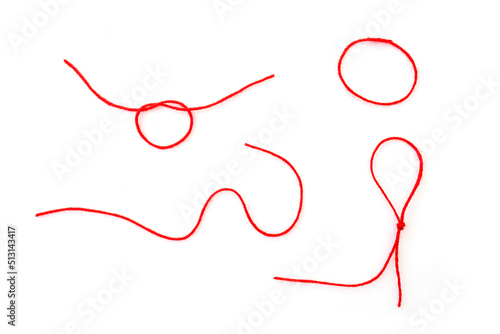 Canvas Print Abstract shapes by woolen red thread, rope isolated on white, top view