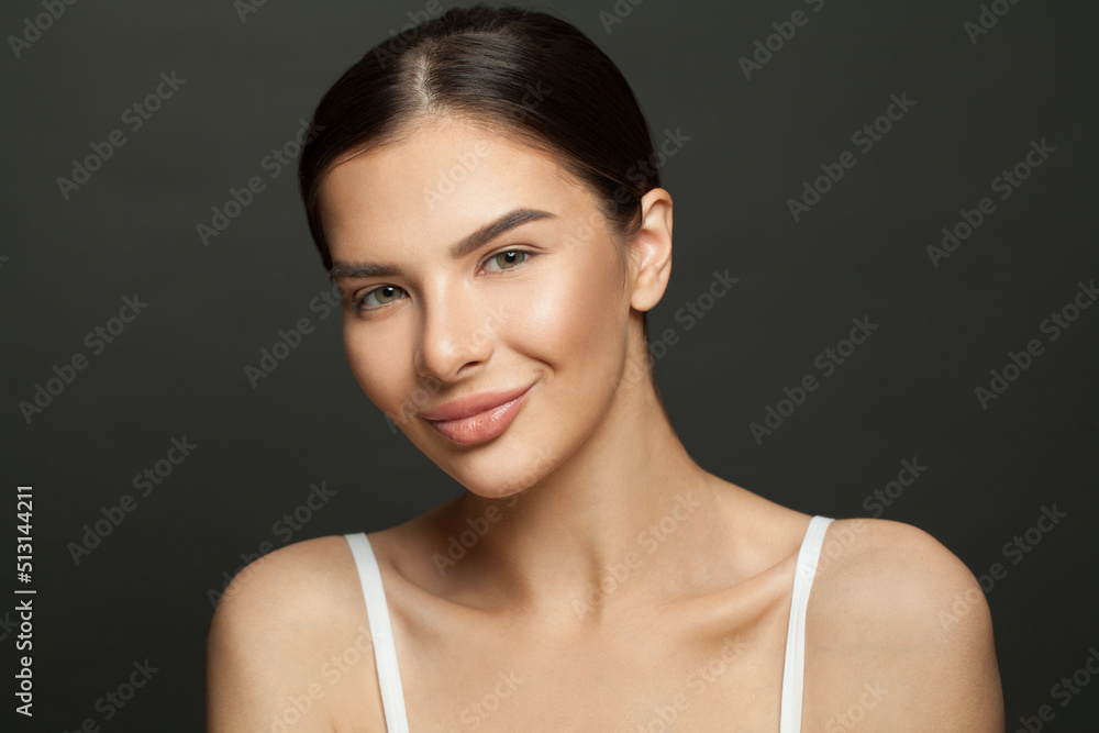 Portrait of smiling beautiful woman. Perfect skin, female face close up on black background. Portrait of smiling beautiful woman. Perfect skin, female face close up on black background.