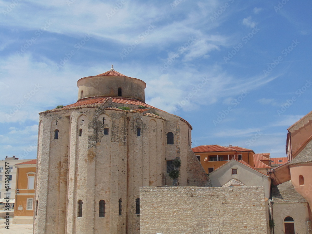 City of Zadar, Croatia, June 01.,2022., View of Saint Donat church against white and blue sky
