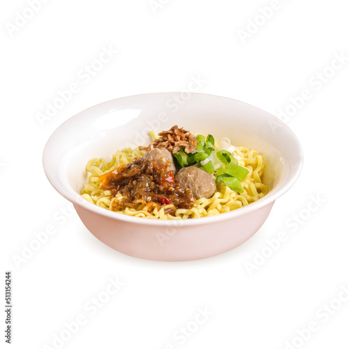 Hot traditional indonesian meatballs bakso with chilli sauce, noodles, vegetables and gravy broth