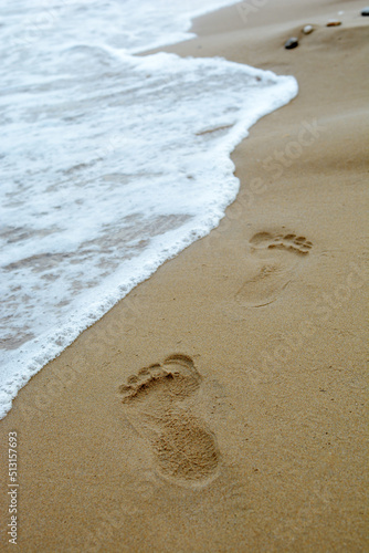 Obraz na plátně Female footprints in the sand