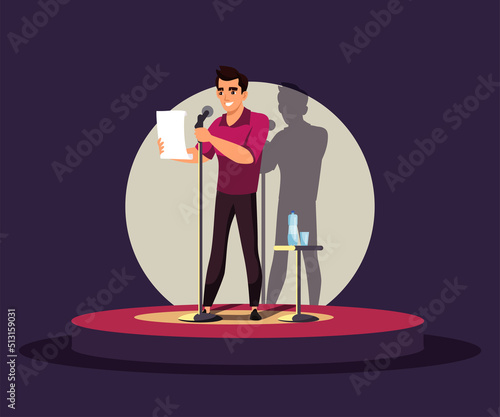 Comic man performing stand up live public comedian show on concert stage in spotlight