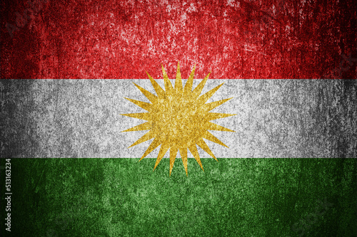 Closeup of grunge Kurdistan flag. Dirty Kurdistan flag on a metal surface photo
