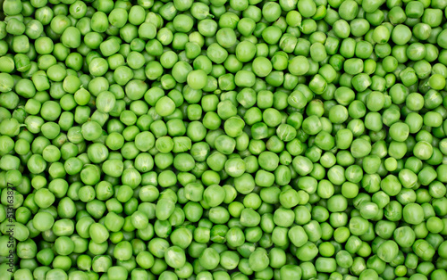 Green peas. Green background. Pea background. View from above. Green pea background. Pea pods from farmland. Pea freshly picked. Organic fresh vegetables. Healthy eating. Country garden harvest.