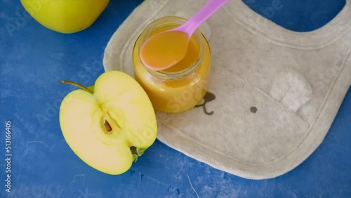 Baby applesauce in a jar. Selective focus. photo