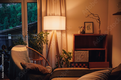 Lamp illuminating a decorative living room with warm light © Thomas