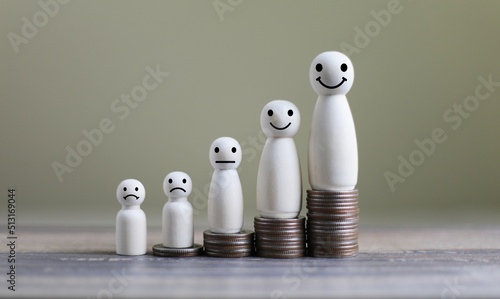 Coins Stack with wooden doll model. Business Concept
