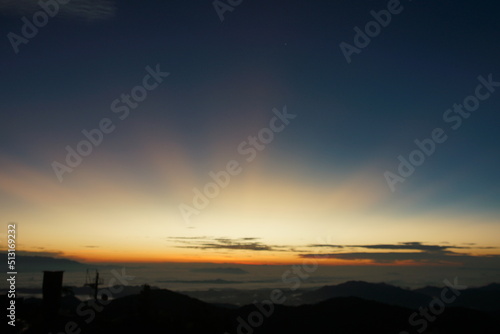 Mountain Sunrise with rays of sun scattered all over