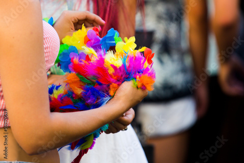 Close up on woman holding colorful feathers