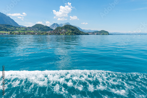 view from lake Thunersee boat trip to Spiez village, waves with whitecap