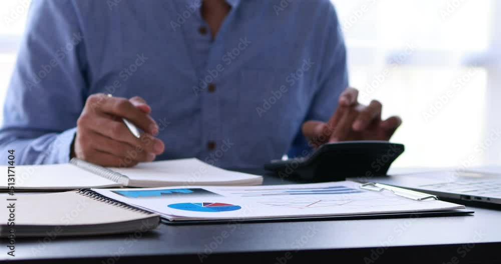 Businessman working at office with documents on his desk, doing planning analyzing the financial report, business plan investment, finance analysis concept Businessman working at office with documents on his desk, doing planning analyzing the financial report, business plan investment, finance analysis concept