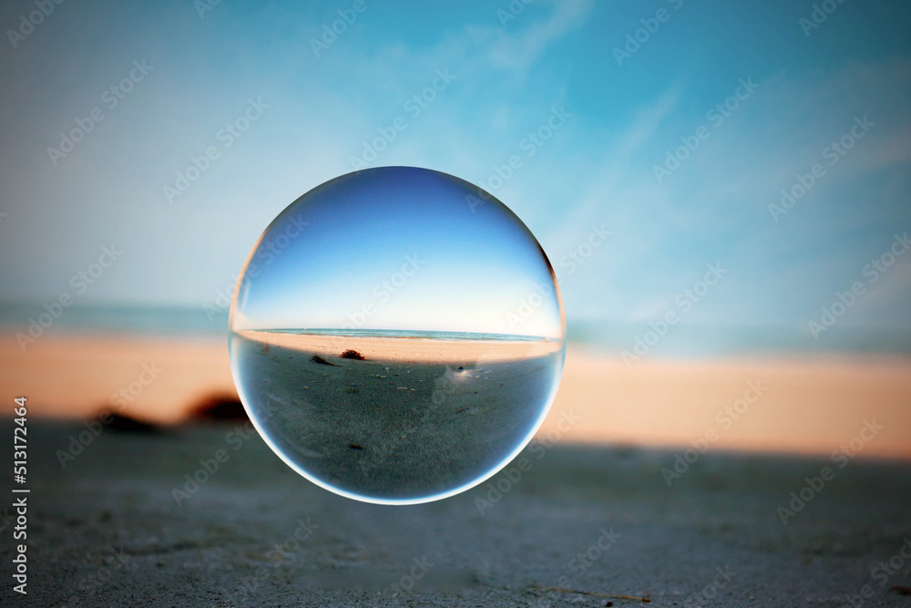 glass sphere on the beach glass sphere on the beach