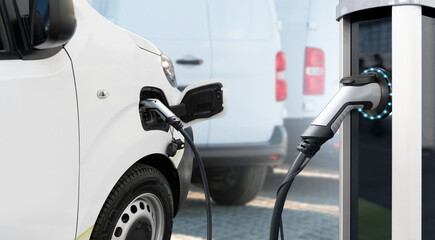 Fotobehang Voertuigen Elektrische bestelwagen bij oplaadstation  © scharfsinn86