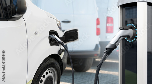 Fotografie, Obraz Electric delivery van with electric vehicles charging station.