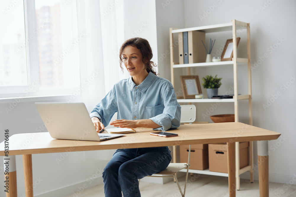 Candidate on vacant place answering question of hr in online meeting using laptop. Curly awesome cheerful attentive woman interested listens to employer about conditions of new job at video call Candidate on vacant place answering question of hr in online meeting using laptop. Curly awesome cheerful attentive woman interested listens to employer about conditions of new job at video call