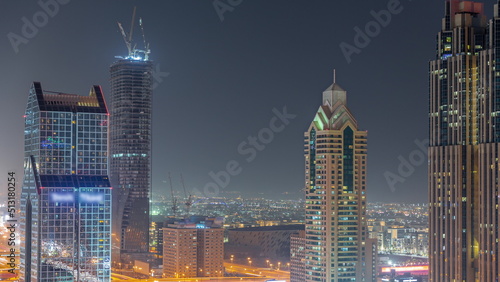 Photography Dubai city skyline panoramic view with metro and cars moving on city's busiest h