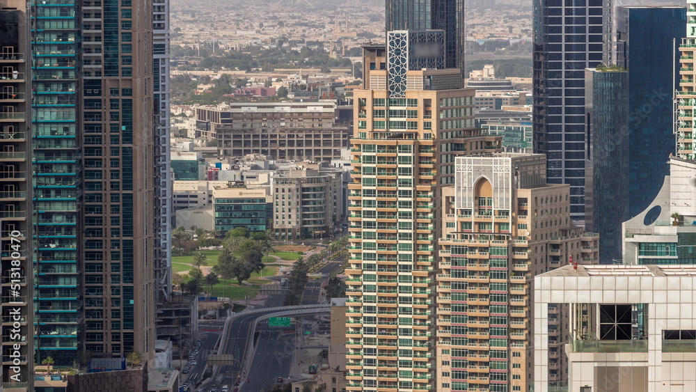 Dubai Marina and Media City districts with modern skyscrapers and office buildings aerial timelapse.