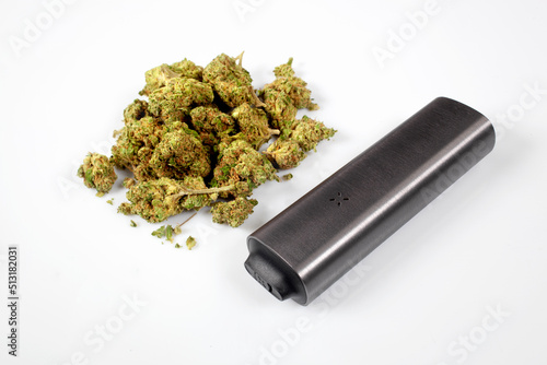 CBD flowers and vaporizer on white background