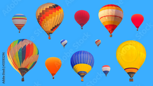 Set of colorful hot air balloons isolated on a blue sky background