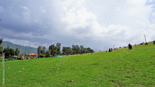 Ooty,Tamilnadu,India-June 04 2022:Tourists enjoying beautiful Wenlock Downs 9th Mile Shooting Point. photo