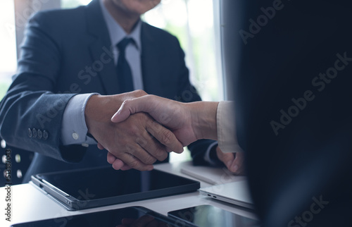 Business deal. Two businessmen shaking hand after signing business contract at office, congratulation, investor, success, business interview, partnership, teamwork concept
