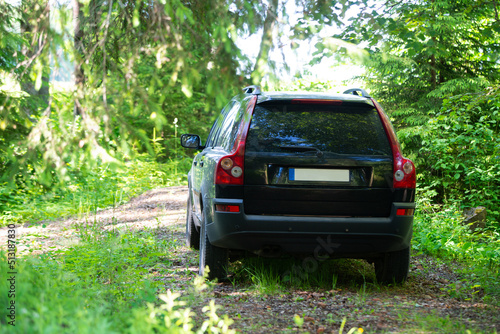 Car in the woods. SUV in the woods. Offroad car.