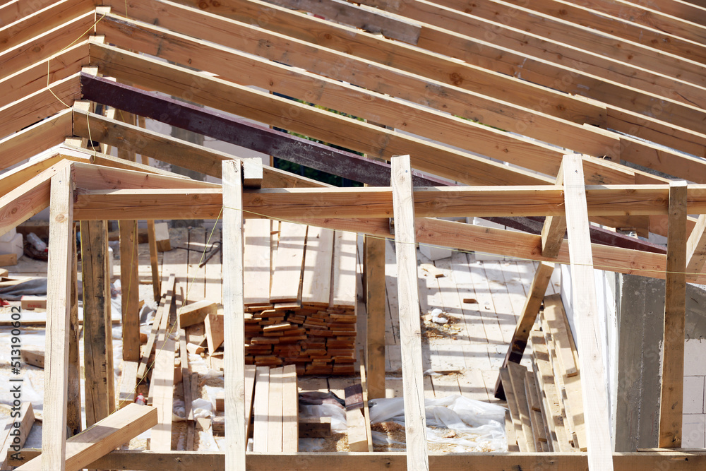 Roofing construction with clay roof tiles. Roofer laying ceramic roof tiles. Lay roof tiles Roofing construction with clay roof tiles. Roofer laying ceramic roof tiles. Lay roof tiles