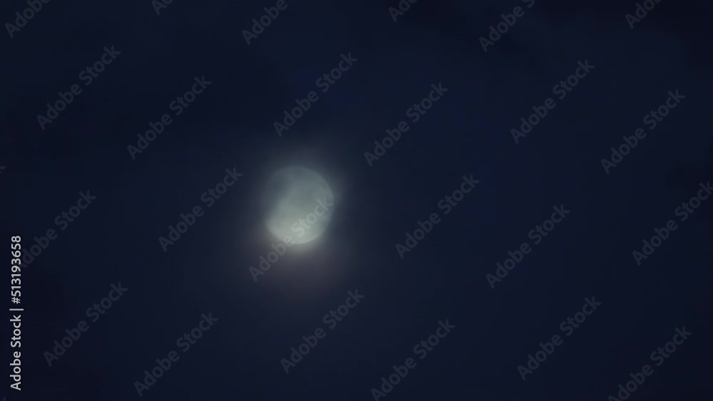 Terrible moonlight with small clouds. Horror movie Moonlight. A dramatic fog month is hidden. Selective soft focus. Foggy picture with moon and clouds Terrible moonlight with small clouds. Horror movie Moonlight. A dramatic fog month is hidden. Selective soft focus. Foggy picture with moon and clouds