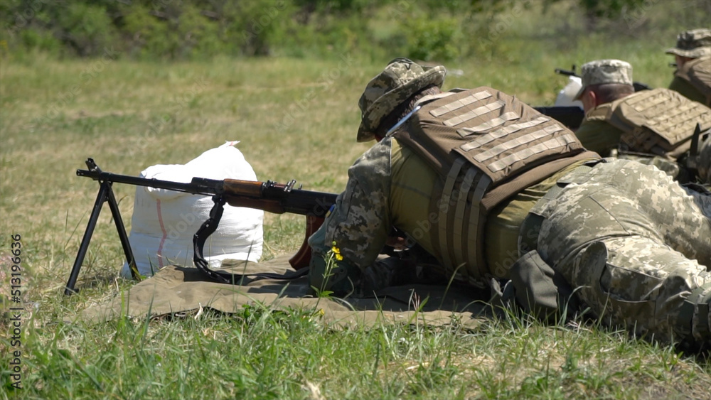 Ukrainian military shoots from a submachine gun