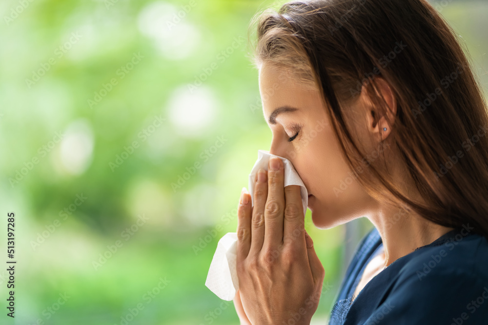 Pollen Allergy In Park. Blowing Nose