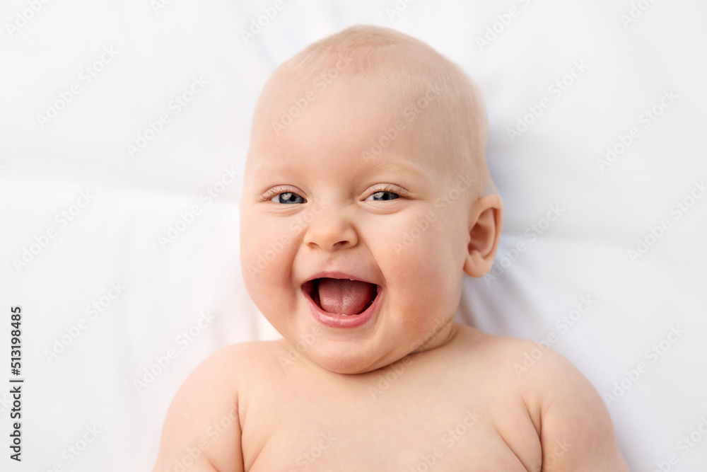 Close-up portrait of laughing blue-eyed baby Close-up portrait of laughing blue-eyed baby