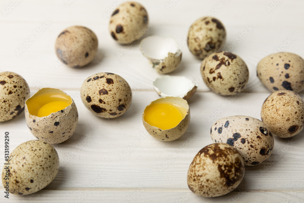 Quail eggs on a white texture background. Whole and broken quail eggs. Natural products. Place for text. Fresh quail eggs. Quail eggs on a white texture background. Whole and broken quail eggs. Natural products. Place for text. Fresh quail eggs.