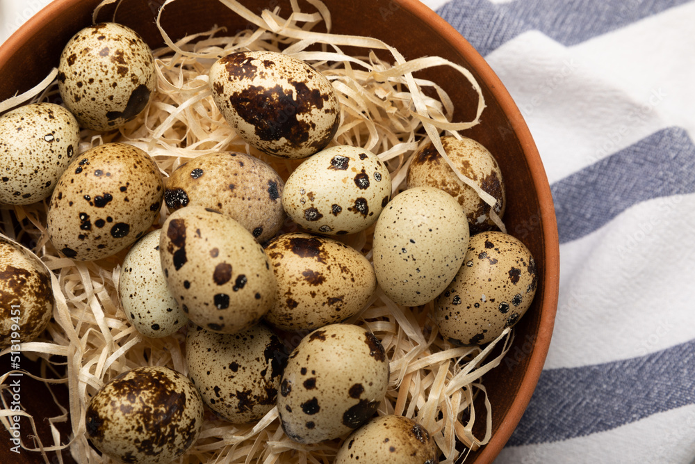 Quail eggs in a bowl on a white texture background. Natural products. Place for text. fresh eggs Quail eggs in a bowl on a white texture background. Natural products. Place for text. fresh eggs