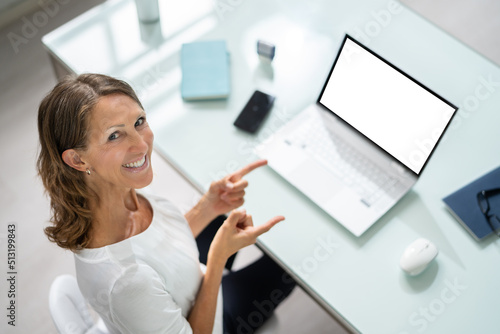 Woman Sitting With Laptop On Couch