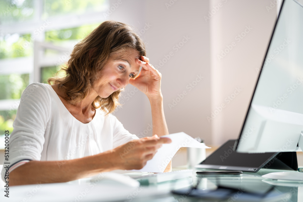 Reading Bad News Letter Bill. Woman In Shock Reading Bad News Letter Bill. Woman In Shock
