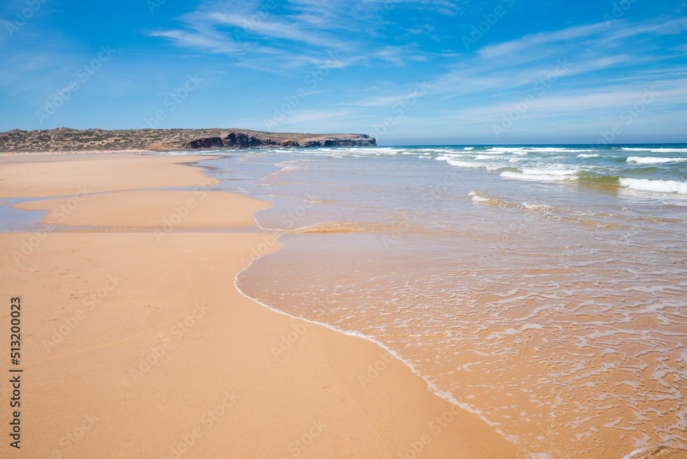 sandy bay Praia do Bordeira with outgoing waves, portugal coast algarve sandy bay Praia do Bordeira with outgoing waves, portugal coast algarve