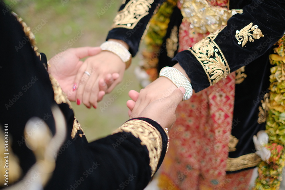 Bride and groom holding hands