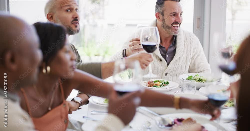 Closeup of a group of diverse friends having a lunch party at a restaurant and sharing a toast with red wine. Colleagues having food and celebrating occasion with an alcoholic beverage at home Closeup of a group of diverse friends having a lunch party at a restaurant and sharing a toast with red wine. Colleagues having food and celebrating occasion with an alcoholic beverage at home