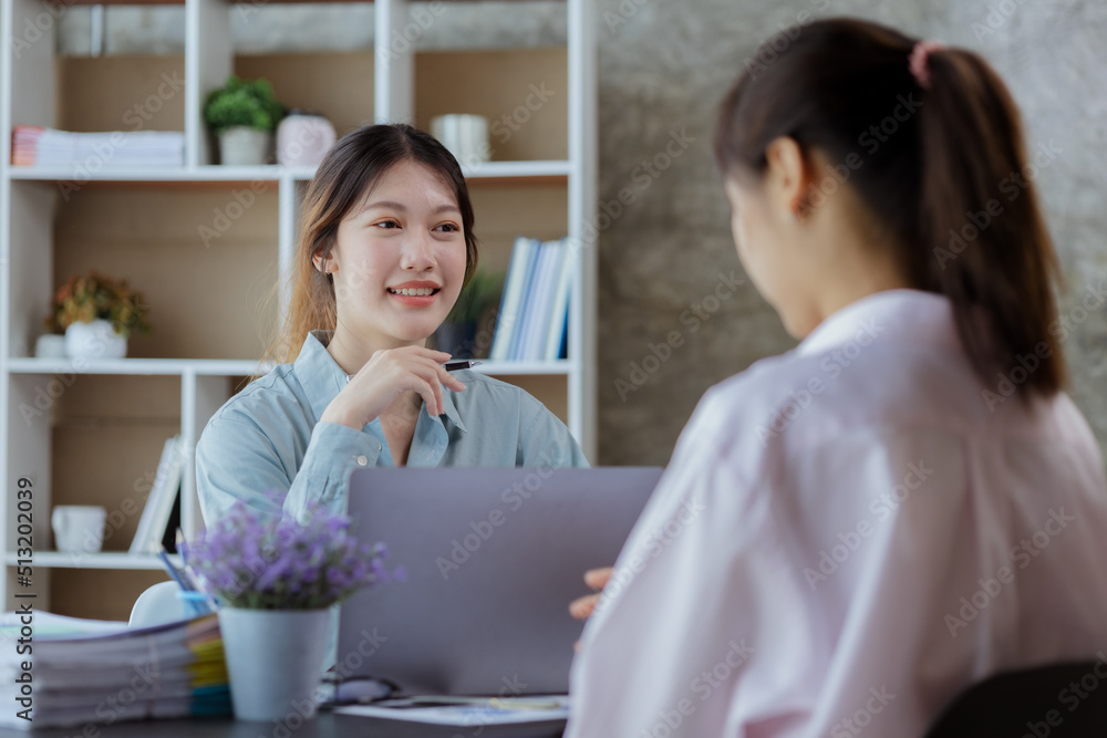Close up beautiful Asian woman chatting with colleagues in company office, businesswoman operating company administration, staff working as a team in department. Working women concept. Close up beautiful Asian woman chatting with colleagues in company office, businesswoman operating company administration, staff working as a team in department. Working women concept.
