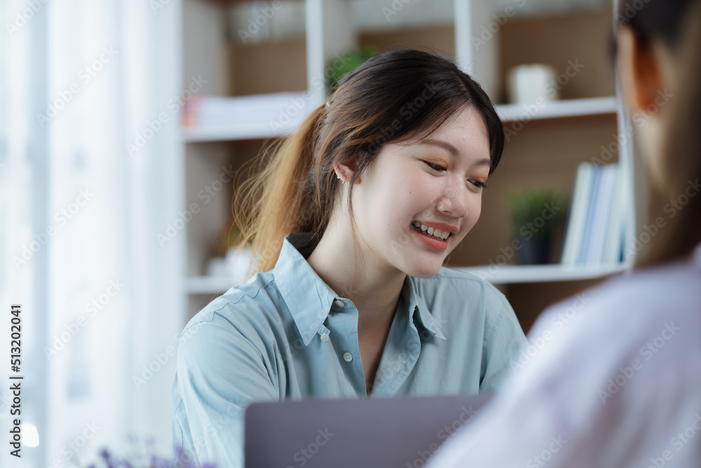 Close up beautiful Asian woman chatting with colleagues in company office, businesswoman operating company administration, staff working as a team in department. Working women concept. Close up beautiful Asian woman chatting with colleagues in company office, businesswoman operating company administration, staff working as a team in department. Working women concept.