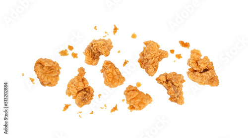 Fried popcorn chicken with crumbs isolated on white background. Top view photo