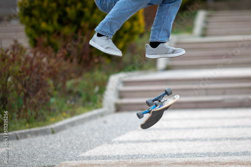 Skateboarder doing jump trick in urban location