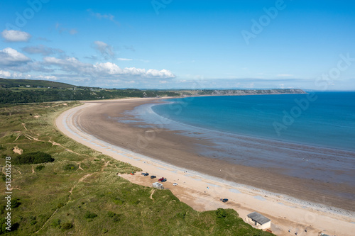 Oxwich Bay on the Gower peninsula in Swansea  UK  a long sweeping sandy bay with a shallow water line with easy access by road from Swansea attracts visitors from all over the UK